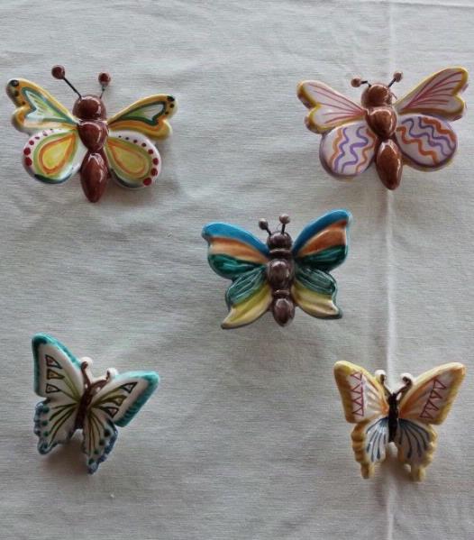Set of five butterflies hand-painted ceramic perforated